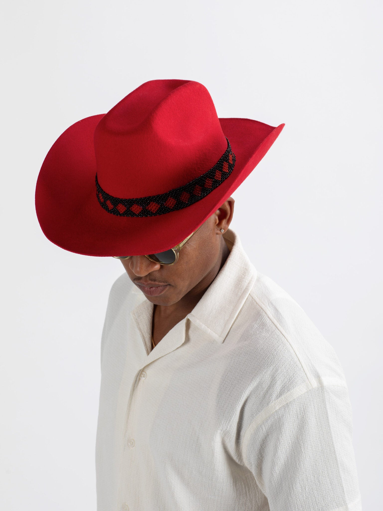 Man wearing Gasabo cowboy hat showing Rwandan beadwork