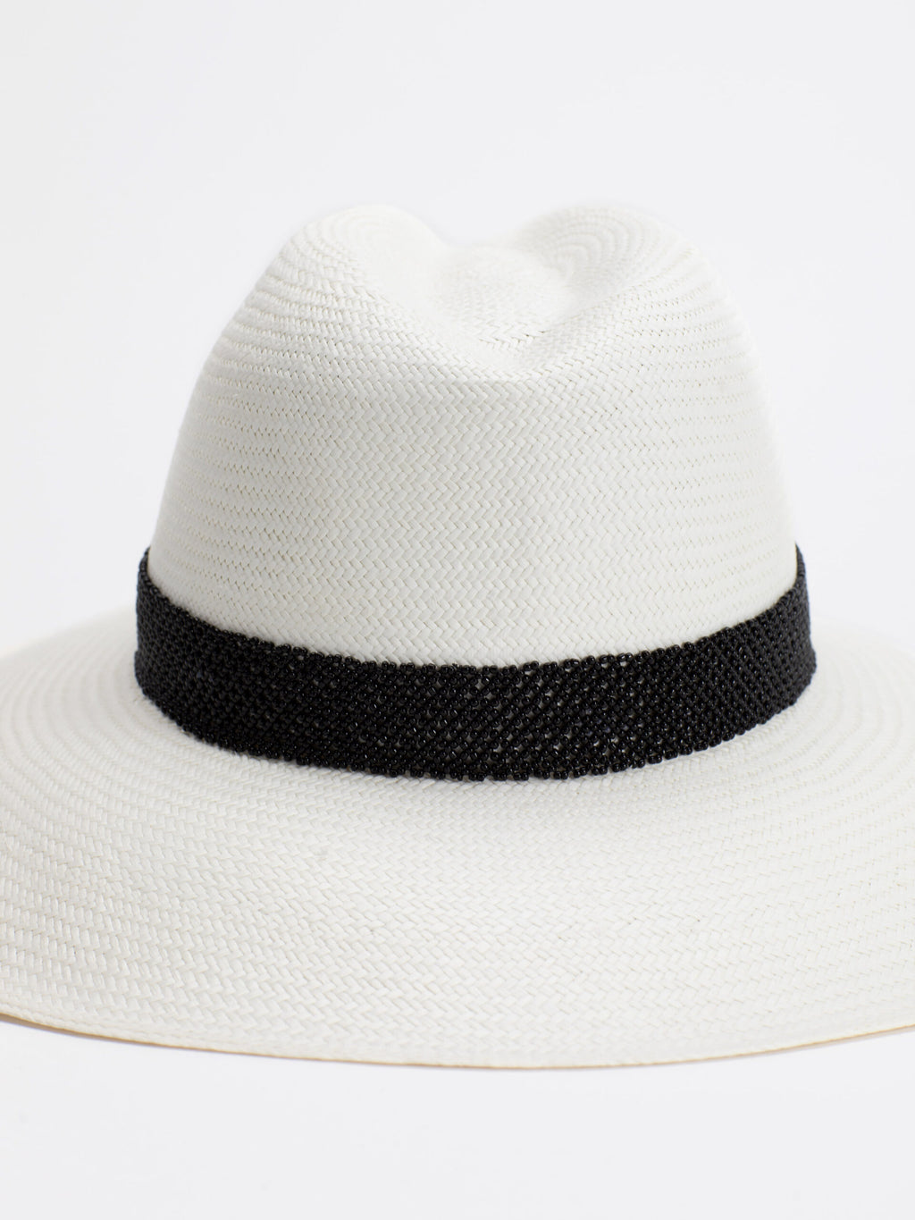Close-up of black Rwandan bead band on Ibiza Panama straw hat