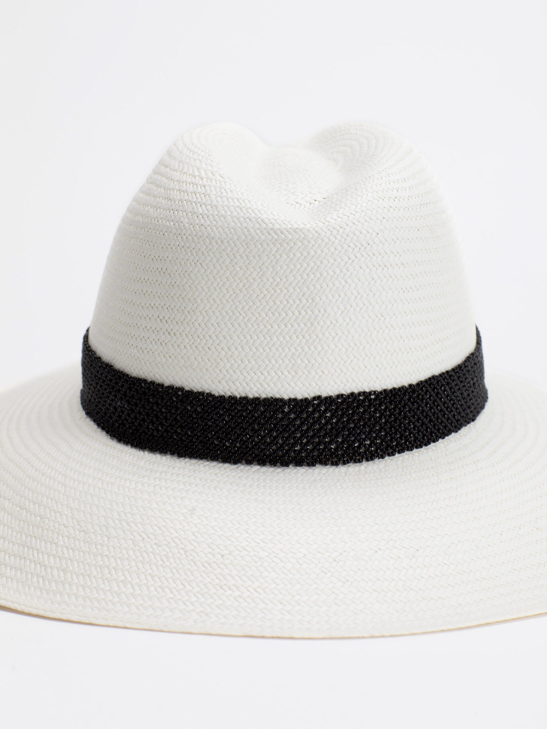 Close-up of black Rwandan bead band on Ibiza Panama straw hat
