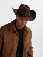 Man wearing Kibuye cowboy hat showing Rwandan beadwork