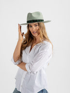 Woman wearing Kona handmade fedora hat
