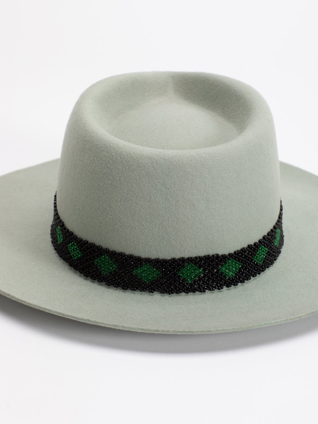 Close-up of Rwandan beaded band on Kona fedora crown
