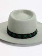 Close-up of Rwandan beaded band on Kona fedora crown

