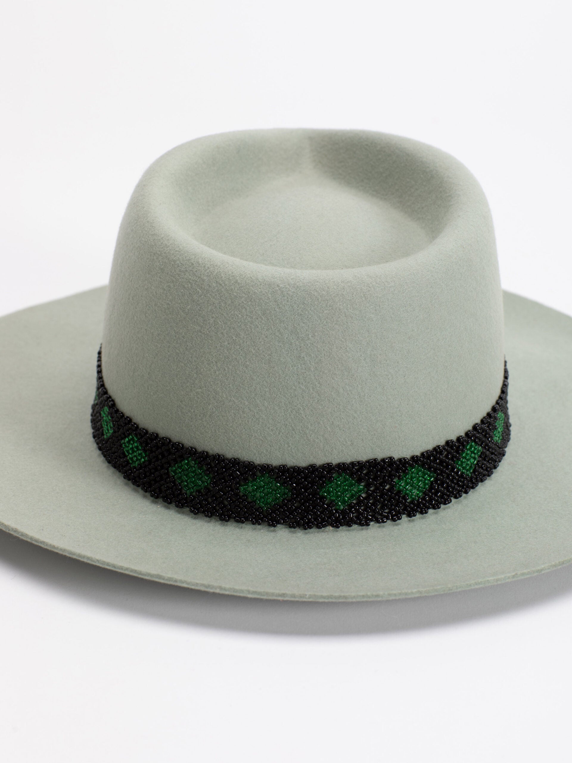 Close-up of Rwandan beaded band on Kona fedora crown
