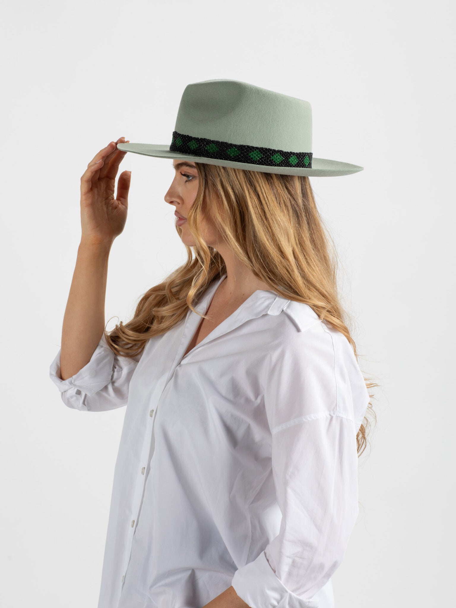 Woman wearing Kona handmade fedora hat