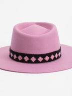 Close-up of black and pink Rwandan bead band on Paris pink fedora crown