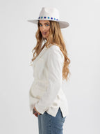Woman wearing white Santorini handmade fedora hat