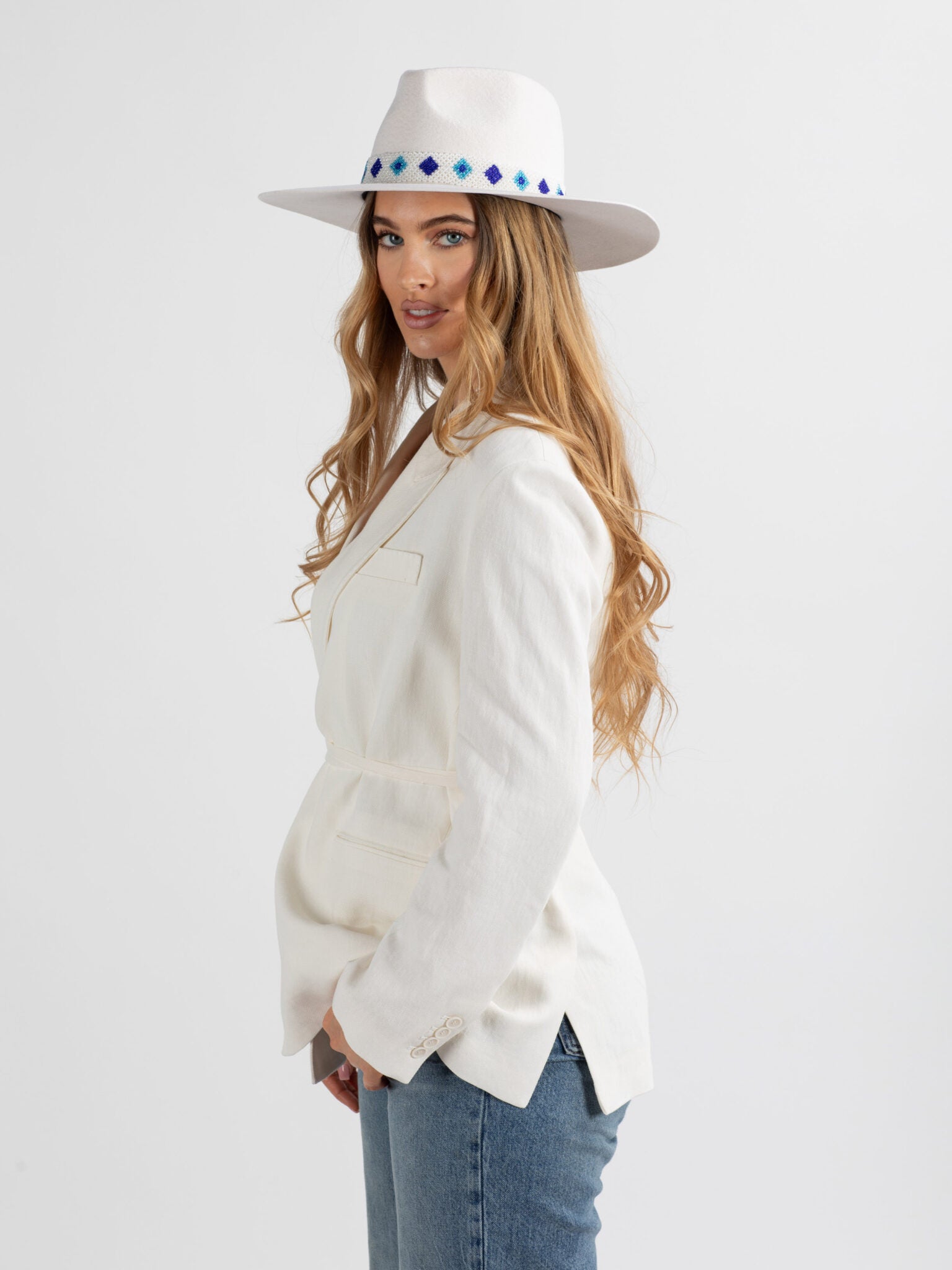 Woman wearing white Santorini handmade fedora hat