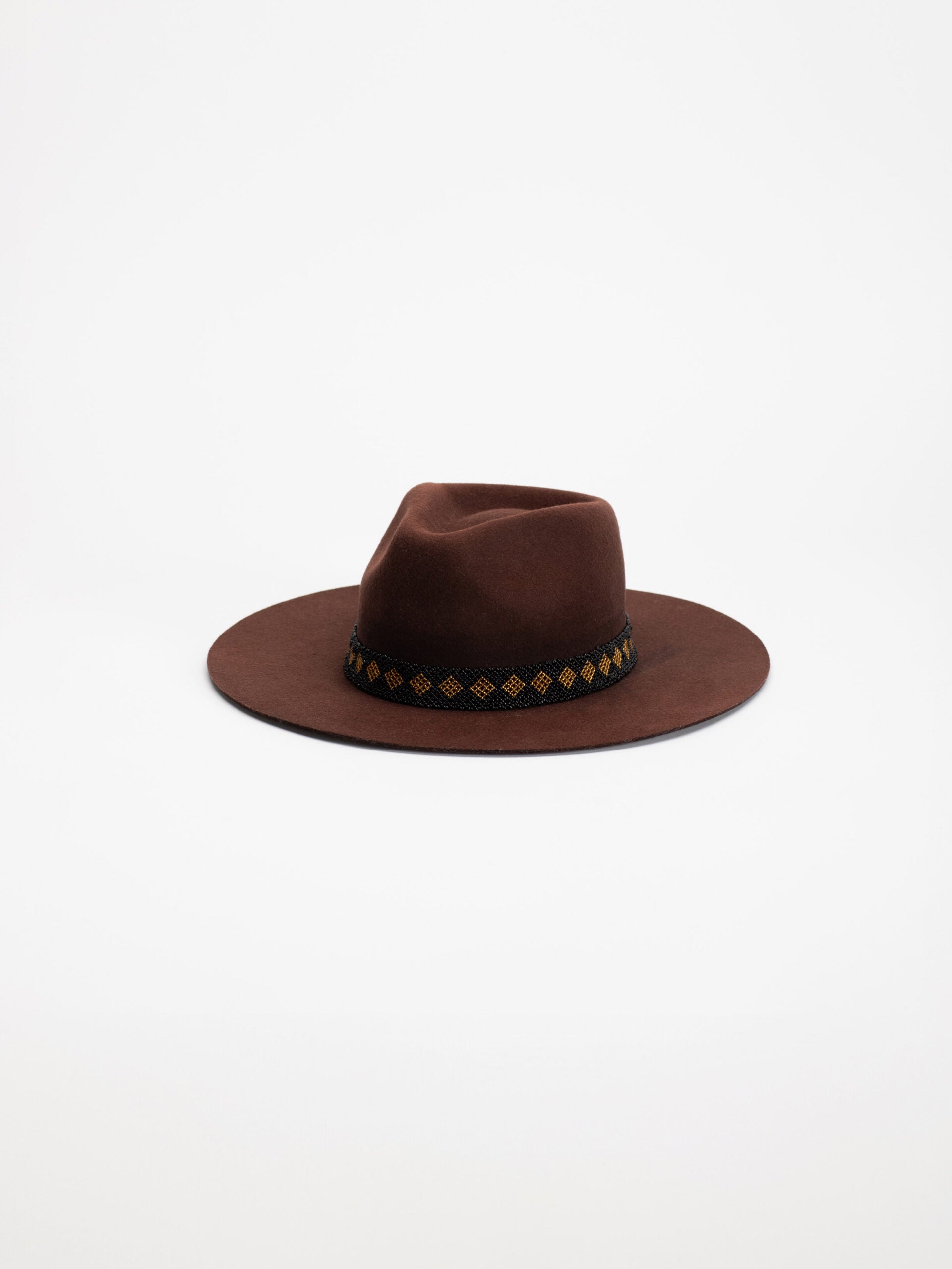 Tahoe handmade fedora hat in rich brown wool with Rwandan beaded band, side view