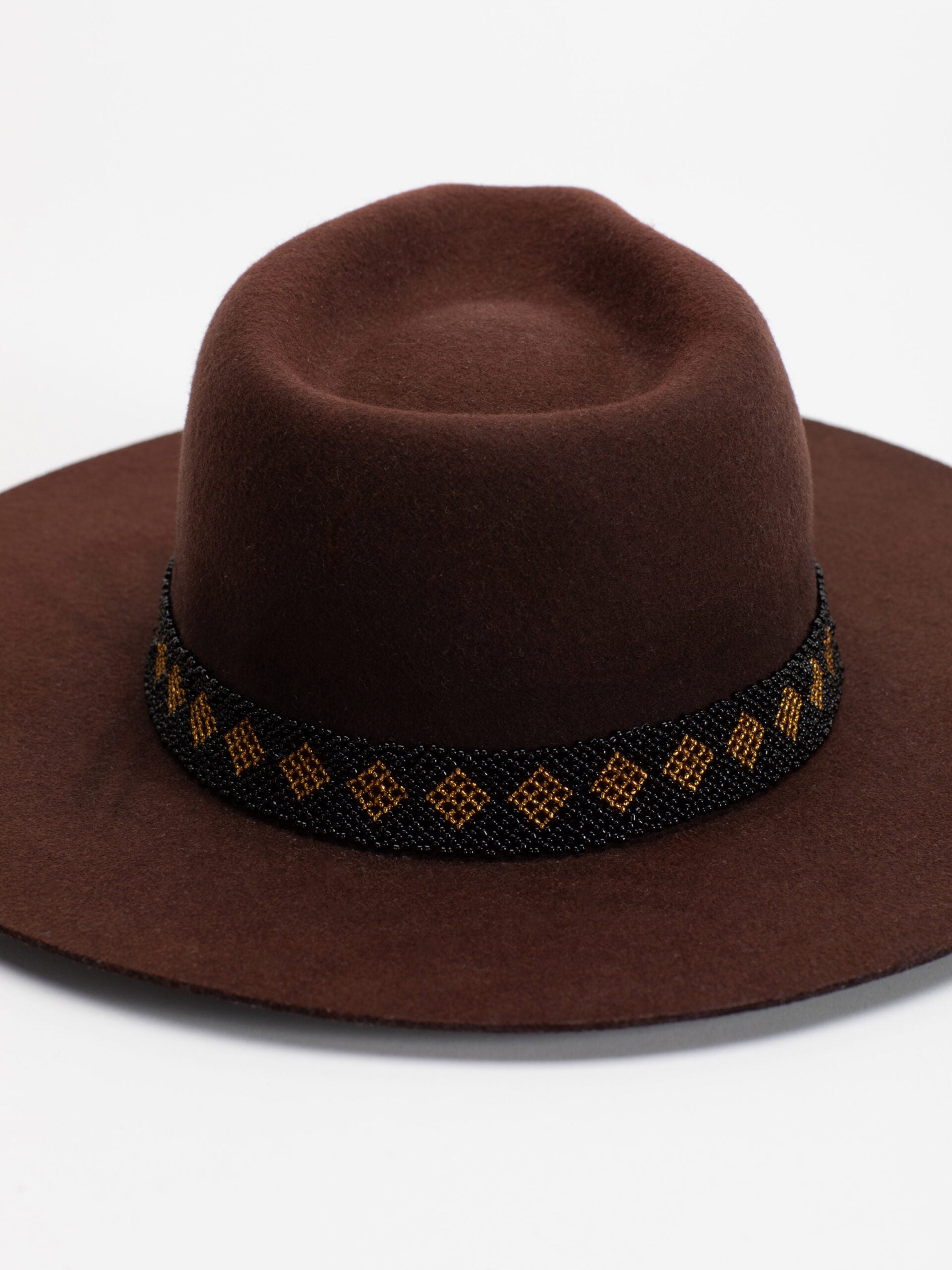 Close-up of Rwandan beaded band on Tahoe brown fedora crown