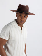 Man wearing brown Tahoe fedora hat showing Rwandan beadwork